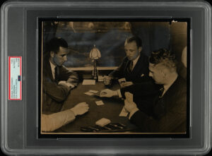 Fox Photos - 'Don Bradman & Team Mates playing cards on way to 1st Ashes Test at Notts' (1938) - PSA Type I Authenticated Photo