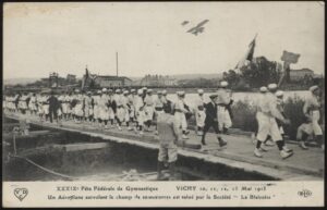 Chicoree - 'Vichy - XXXIX Federal Gymnastics Festival Aeroplane Flyover' (1913) - Unused Postcard